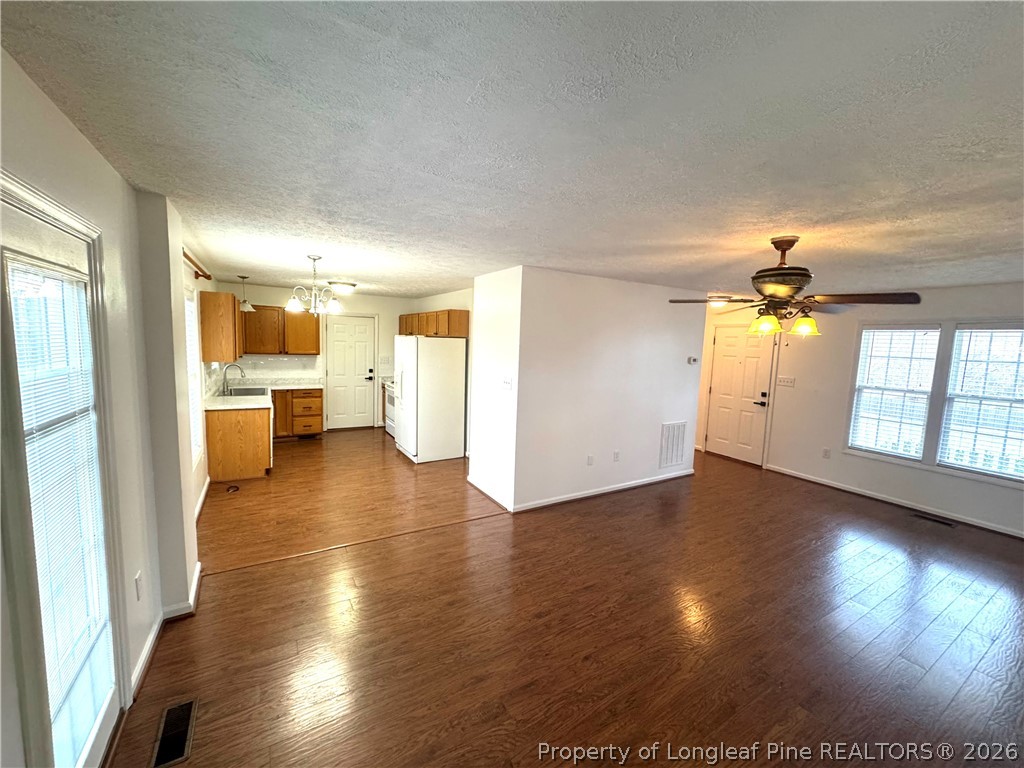 1050 Roundabout Road Cameron, NC 28326 - Photo 7 of 20 wooden floor in an empty room with a window
