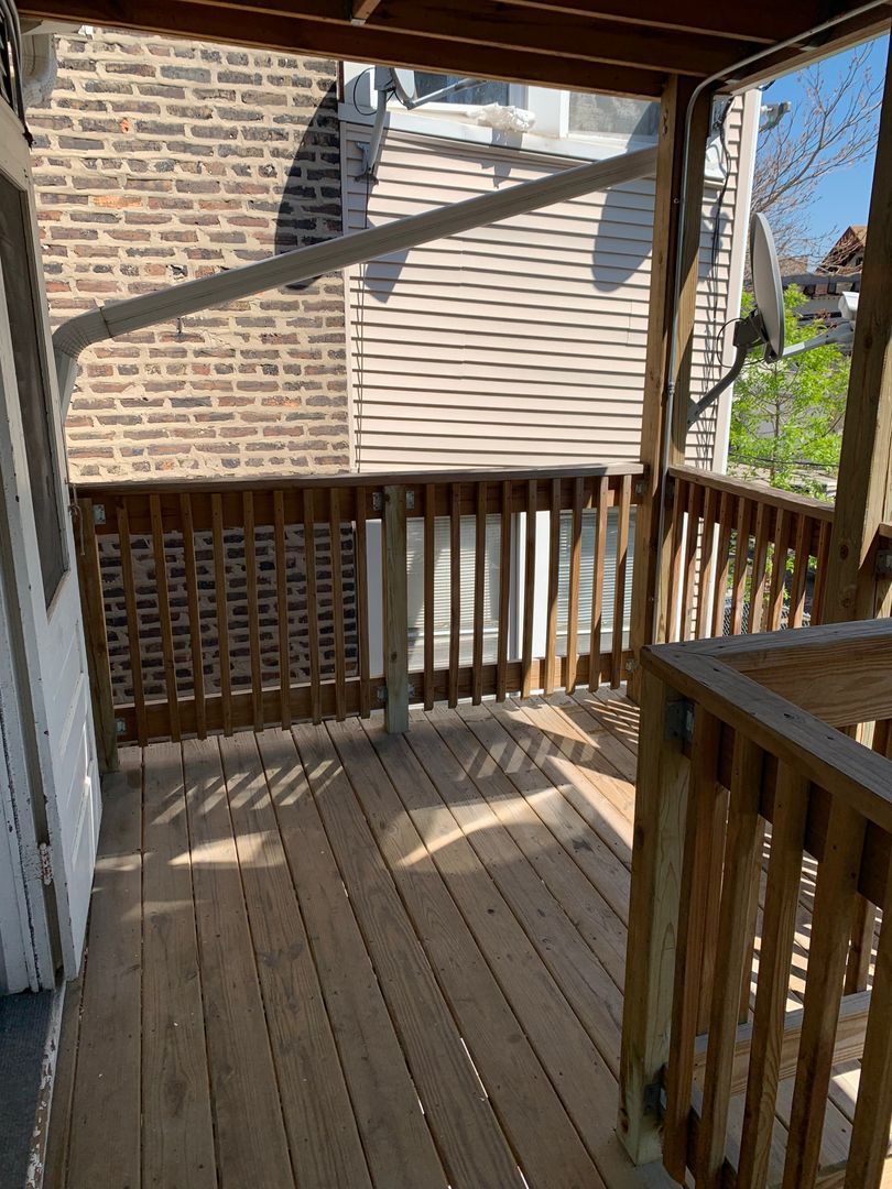 1751 West Cullerton Street, Unit 2R Chicago, IL 60608 - Photo 4 of 4 a view of backyard with wooden floor