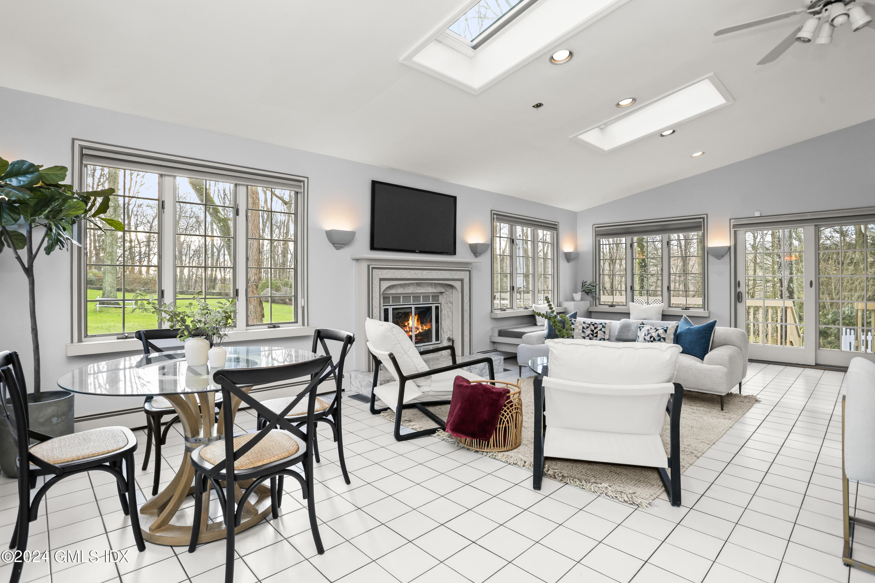 356 Haviland Road Stamford, CT 06903 - Photo 15 of 40 a living room with fireplace furniture and a flat screen tv