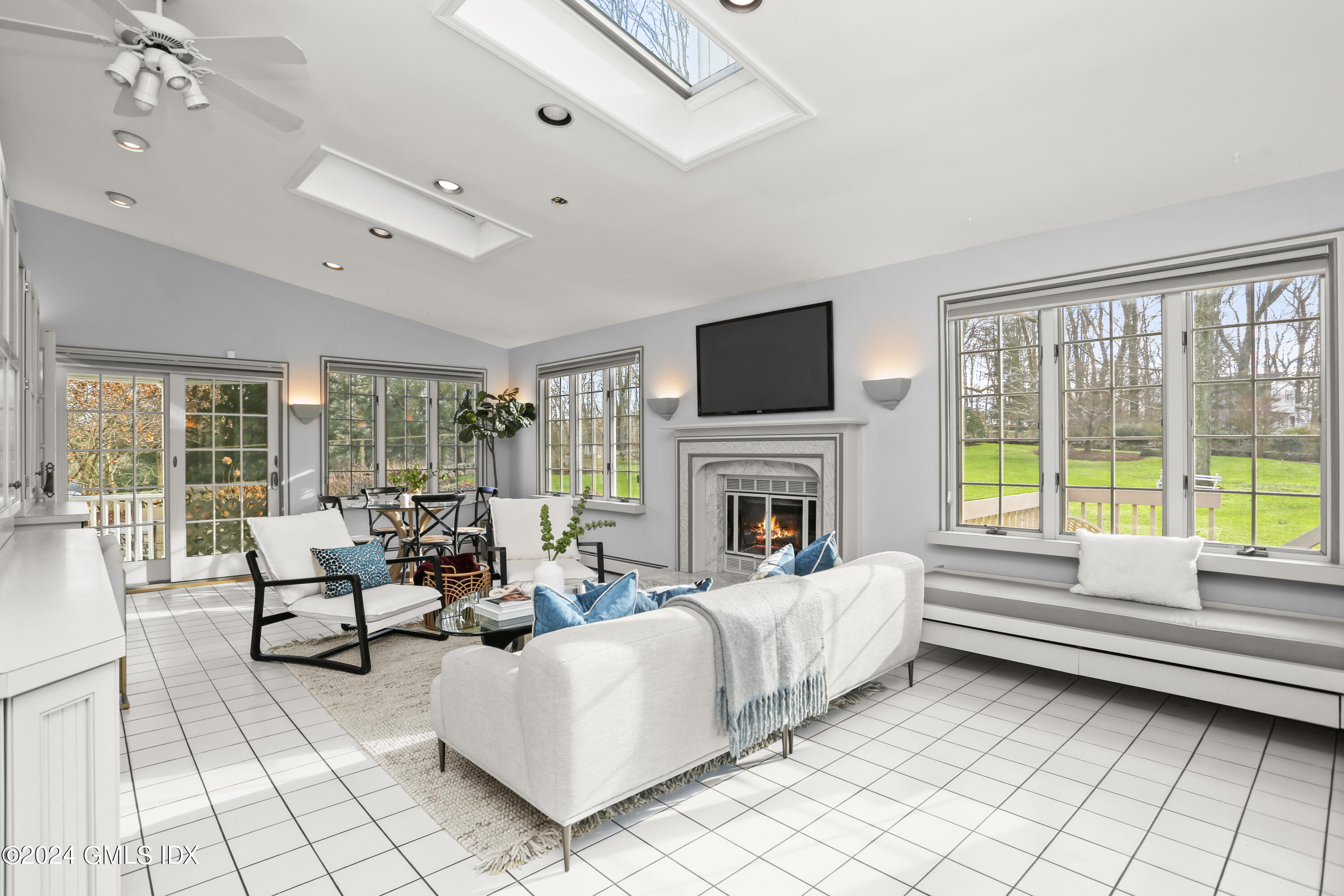 356 Haviland Road Stamford, CT 06903 - Photo 17 of 40 a living room with furniture fireplace and a flat screen tv