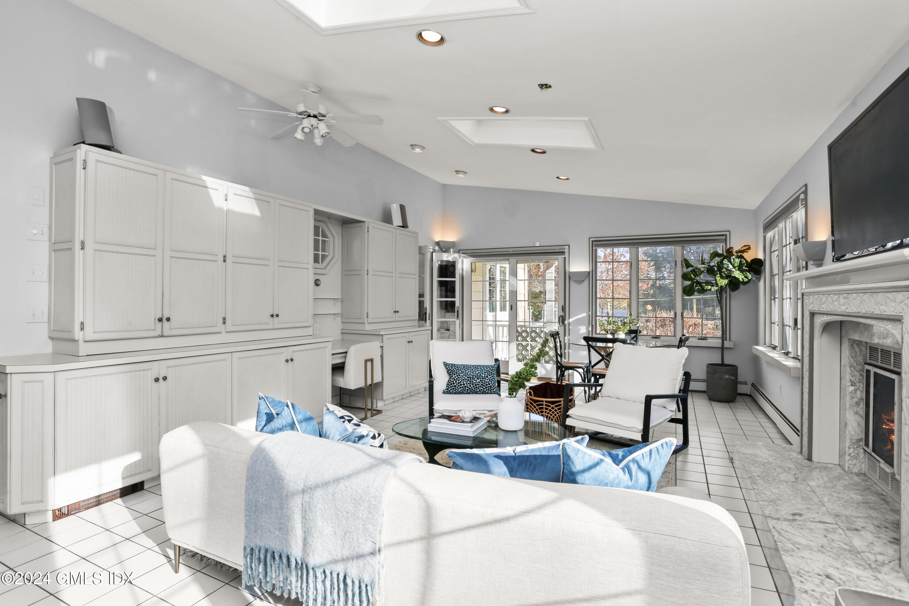 356 Haviland Road Stamford, CT 06903 - Photo 18 of 40 a living room with fireplace furniture and a flat screen tv