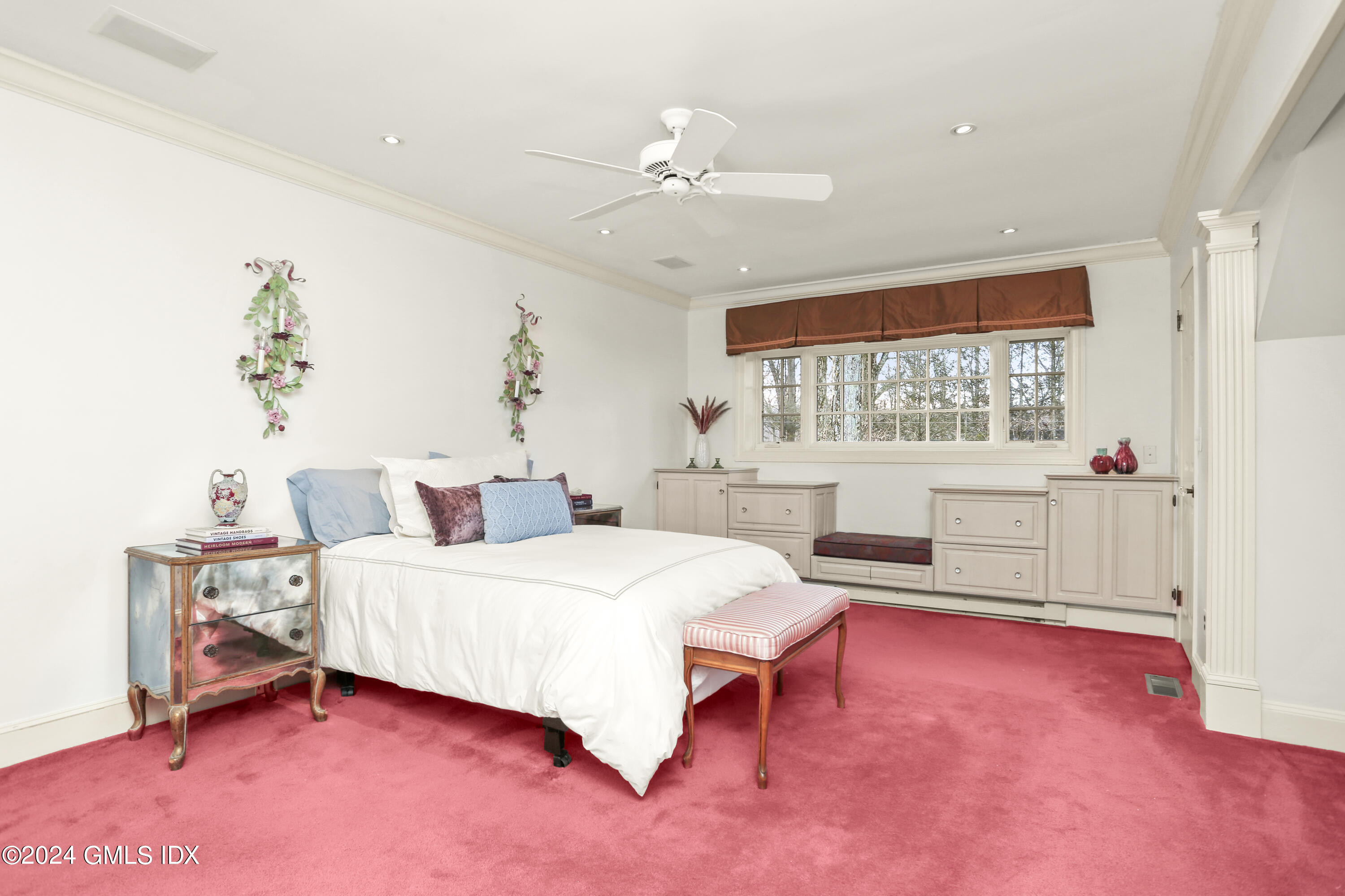 356 Haviland Road Stamford, CT 06903 - Photo 22 of 40 a bedroom with a bed and a chandelier