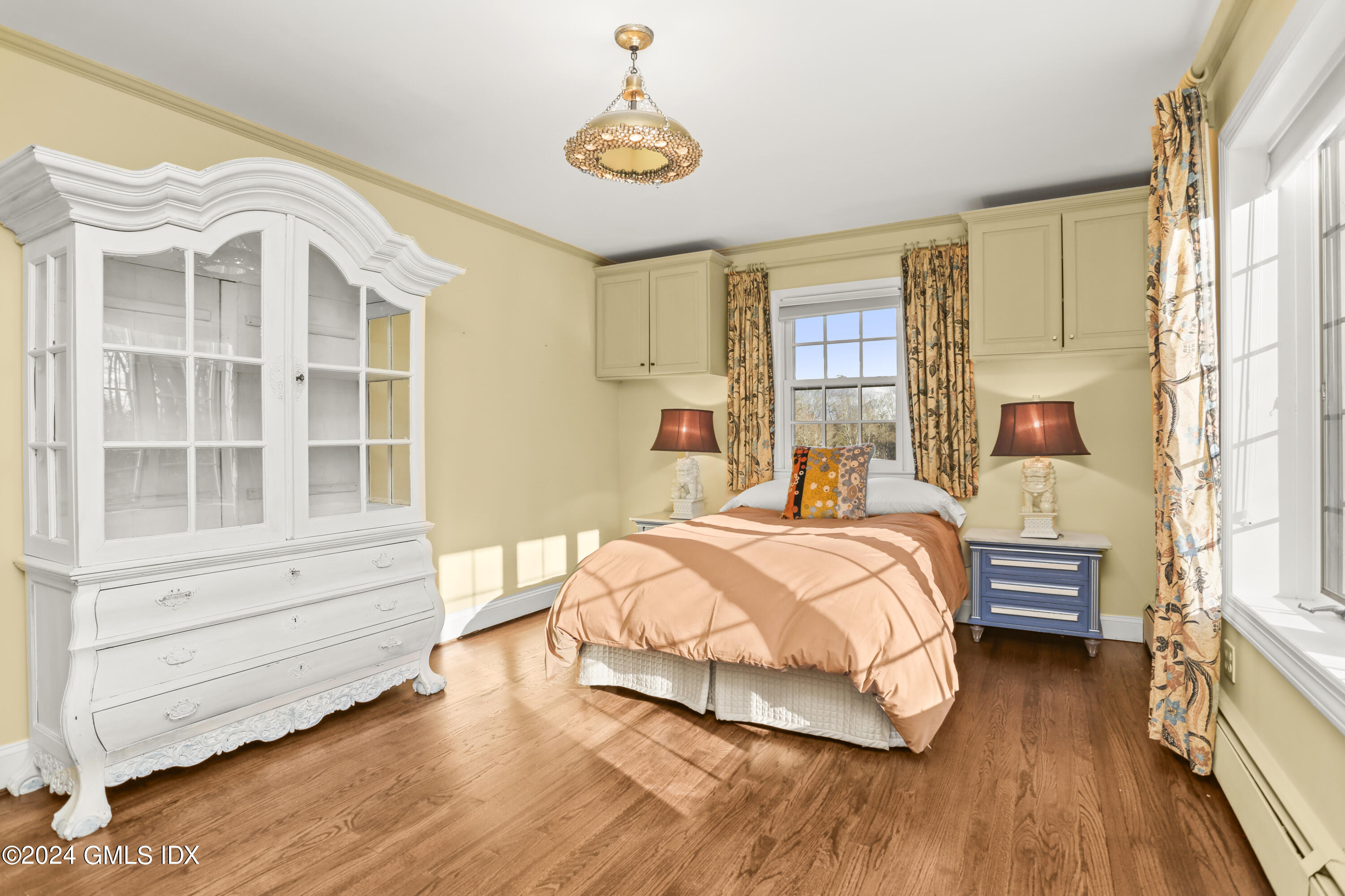 356 Haviland Road Stamford, CT 06903 - Photo 25 of 40 a bedroom with a bed and wooden floor