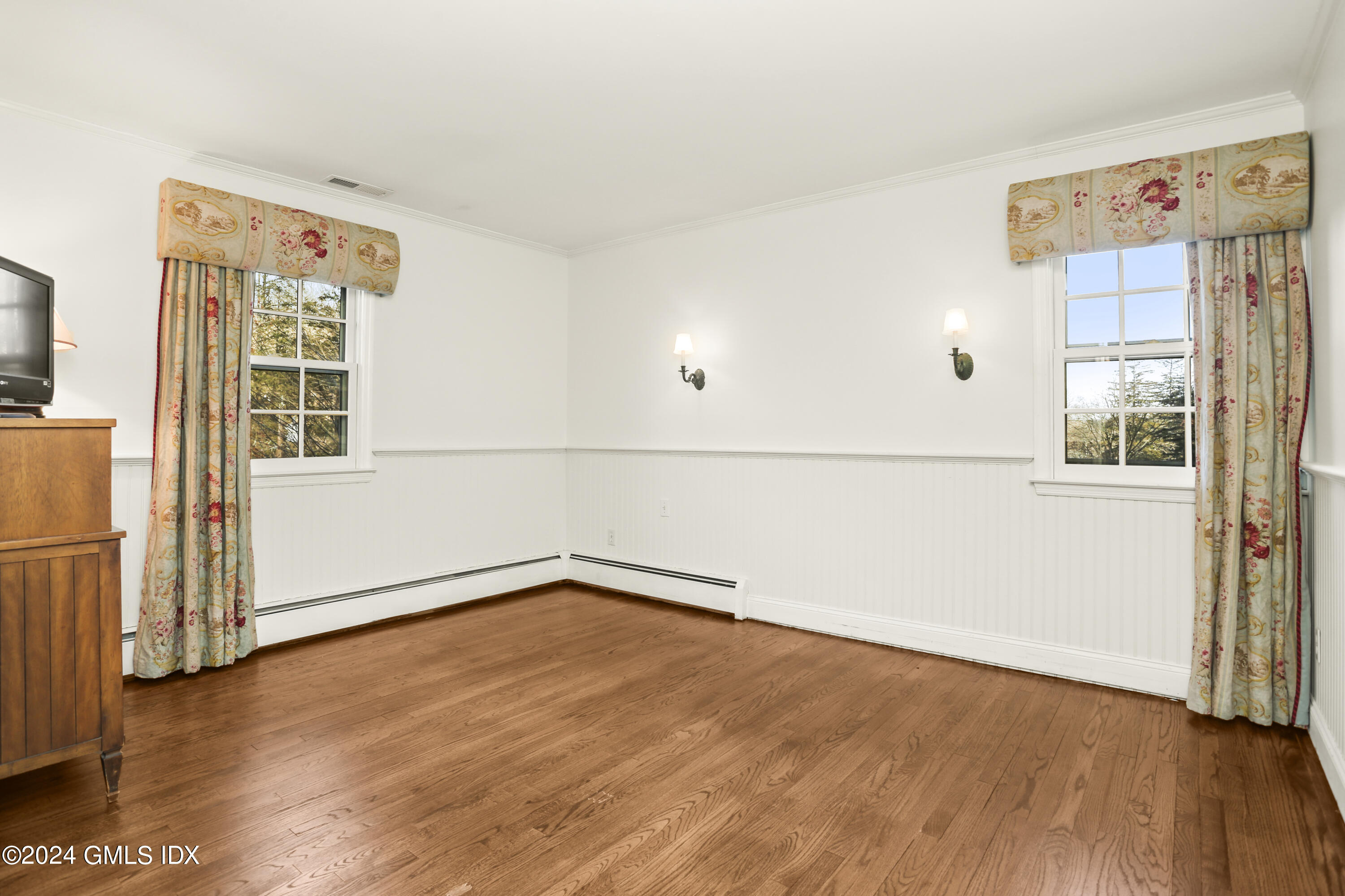 356 Haviland Road Stamford, CT 06903 - Photo 27 of 40 an empty room with wooden floor and windows