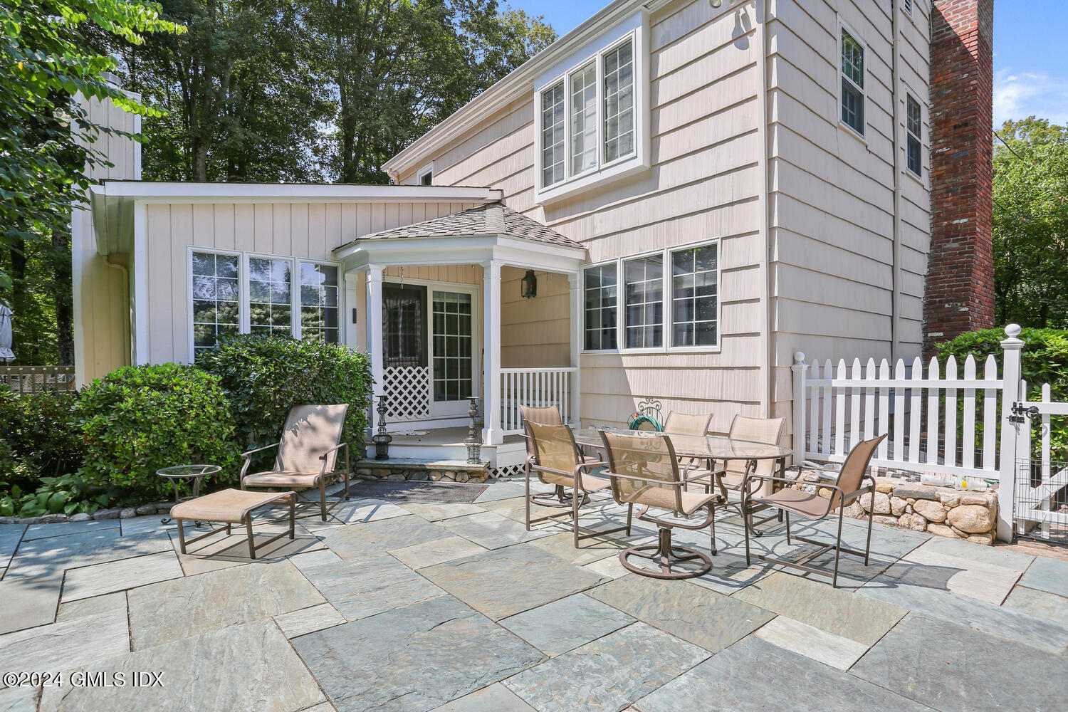 356 Haviland Road Stamford, CT 06903 - Photo 37 of 40 a view of a patio with couple of chairs and a bench