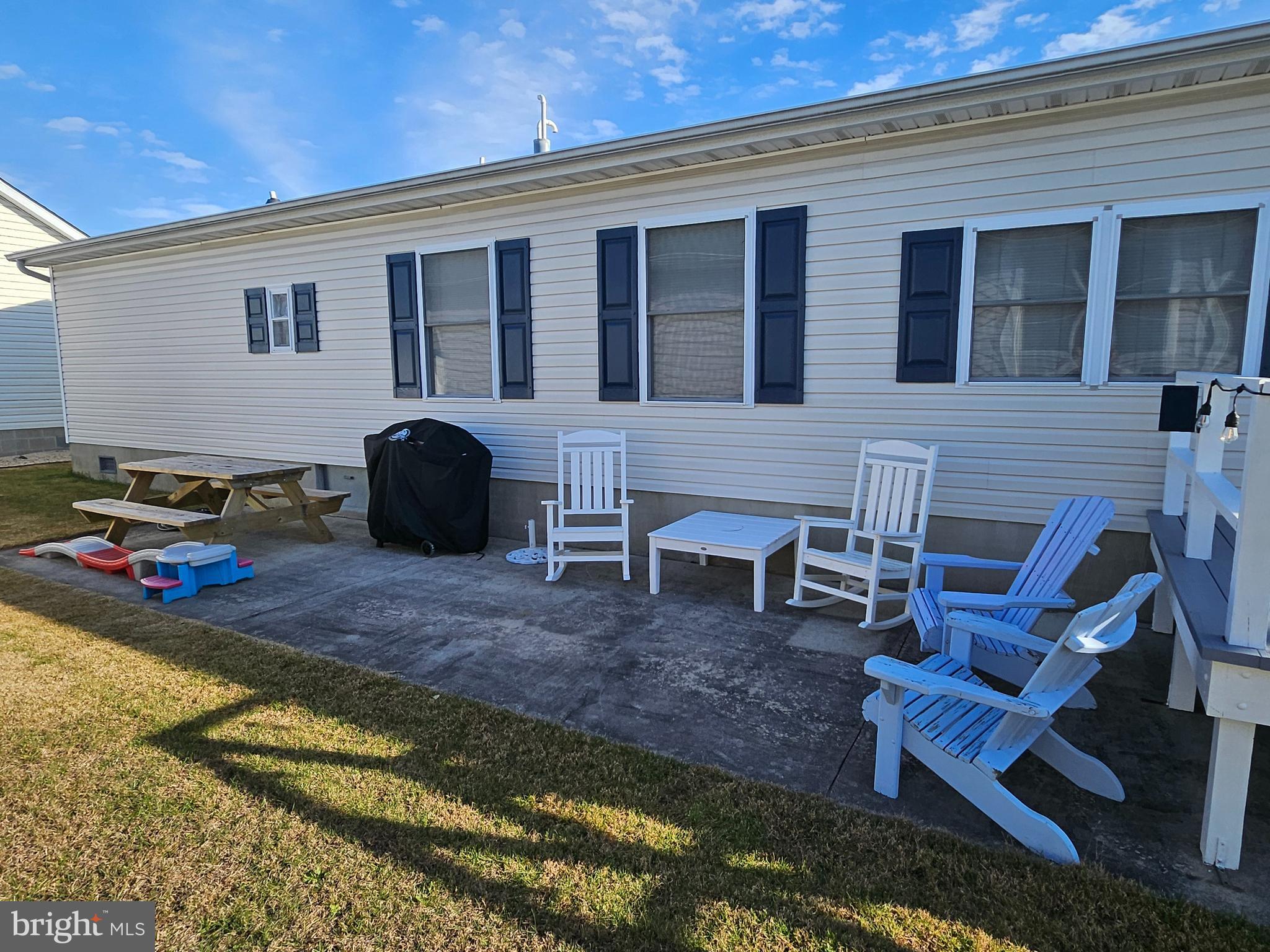 160 Clamshell Road Ocean City, MD 21842 - Photo 14 of 32 a backyard of a house with seating space