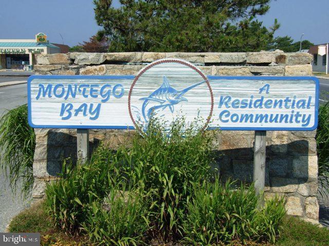 160 Clamshell Road Ocean City, MD 21842 - Photo 16 of 32 a view of a sign board