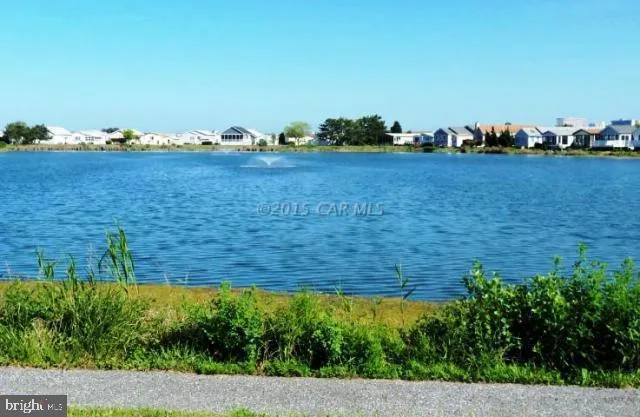 a view of a backyard with swimming pool