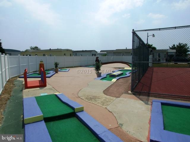 160 Clamshell Road Ocean City, MD 21842 - Photo 22 of 32 a view of a chairs and table on the terrace