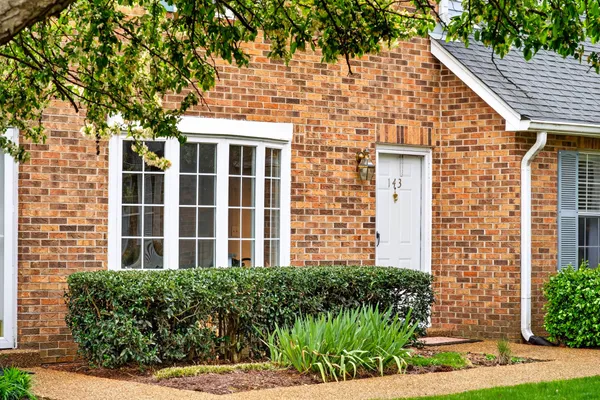 a view of a livingroom with furniture and gym equipment
