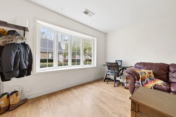 a kitchen with a table and chairs in it