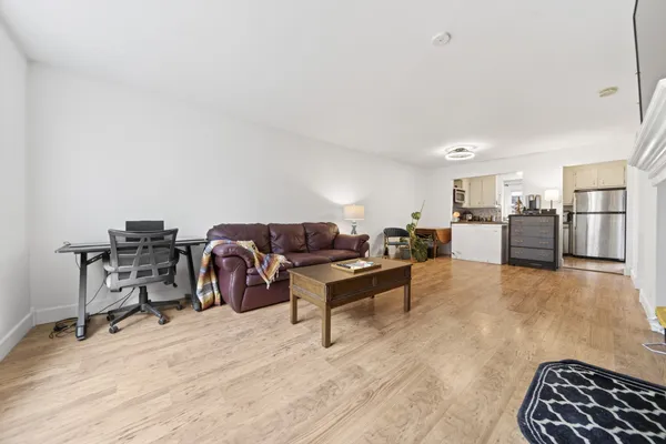 a bathroom with a sink a mirror and vanity