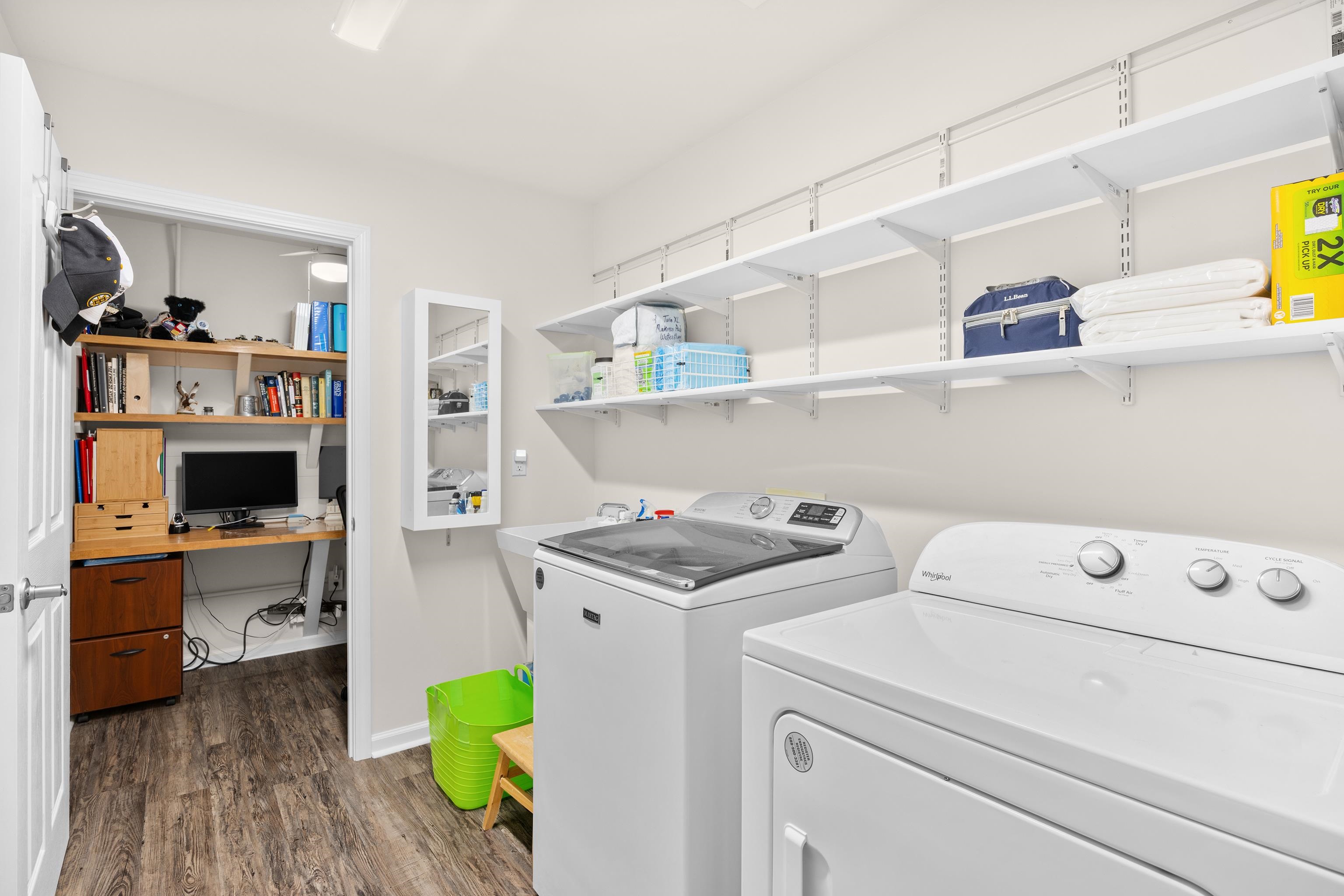 340 Arlington Circle, Unit 340 Murrells Inlet, SC 29576 - Photo 21 of 39 The washer and dryer are newer, purchased in 2023. The shelving and mirrored ironing board cabinet were installed at the same time.