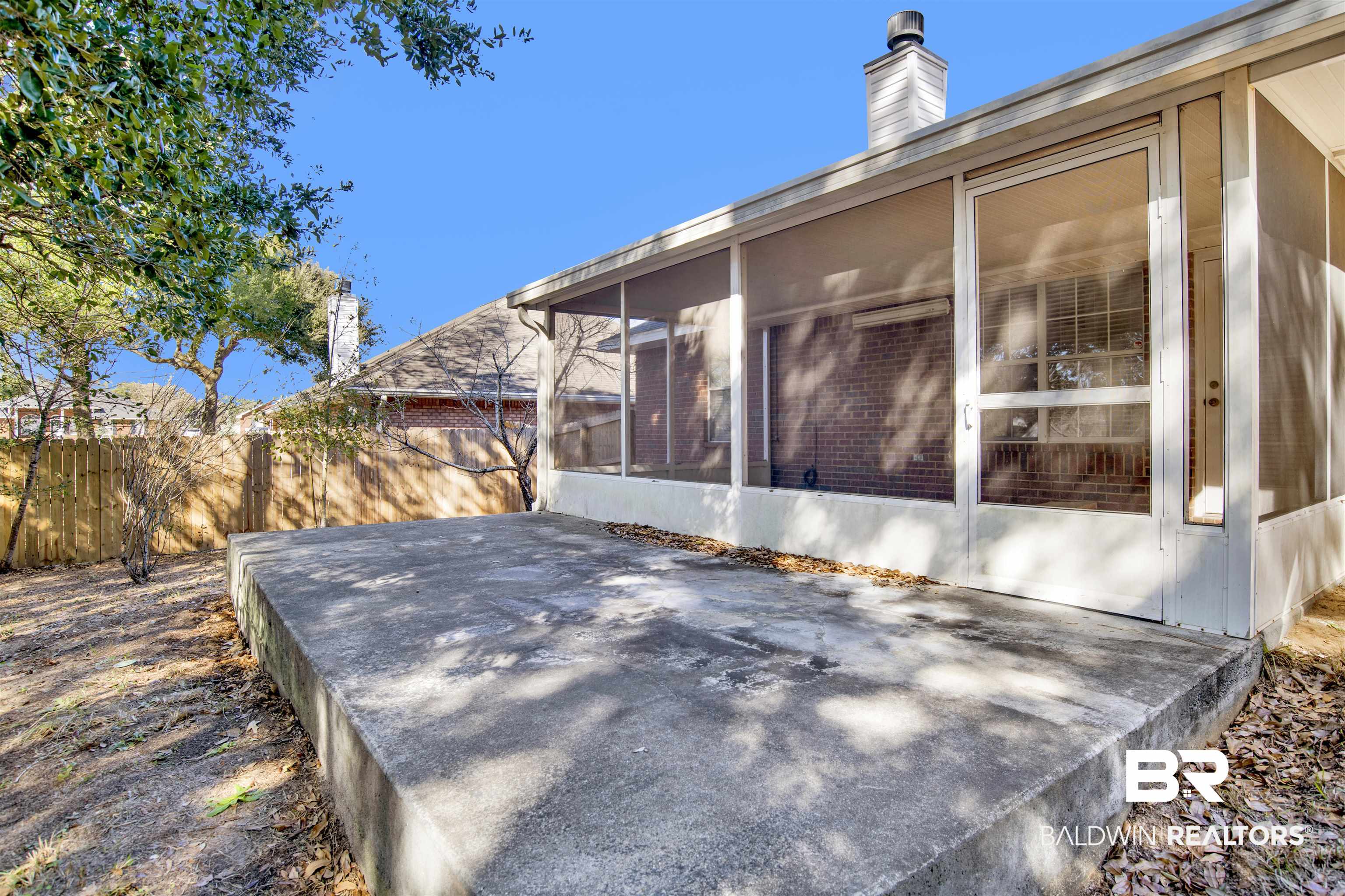 7297 Bridgemill Drive Mobile, AL 36619 - Photo 27 of 33 View of side of property featuring a sunroom and a chimney