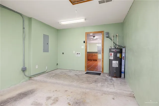 an empty room with closet and cabinet
