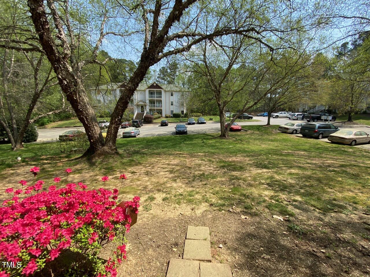 2011 Quaker Landing, Unit 102 Raleigh, NC 27603 - Photo 11 of 12 a view of yard with tree and green space