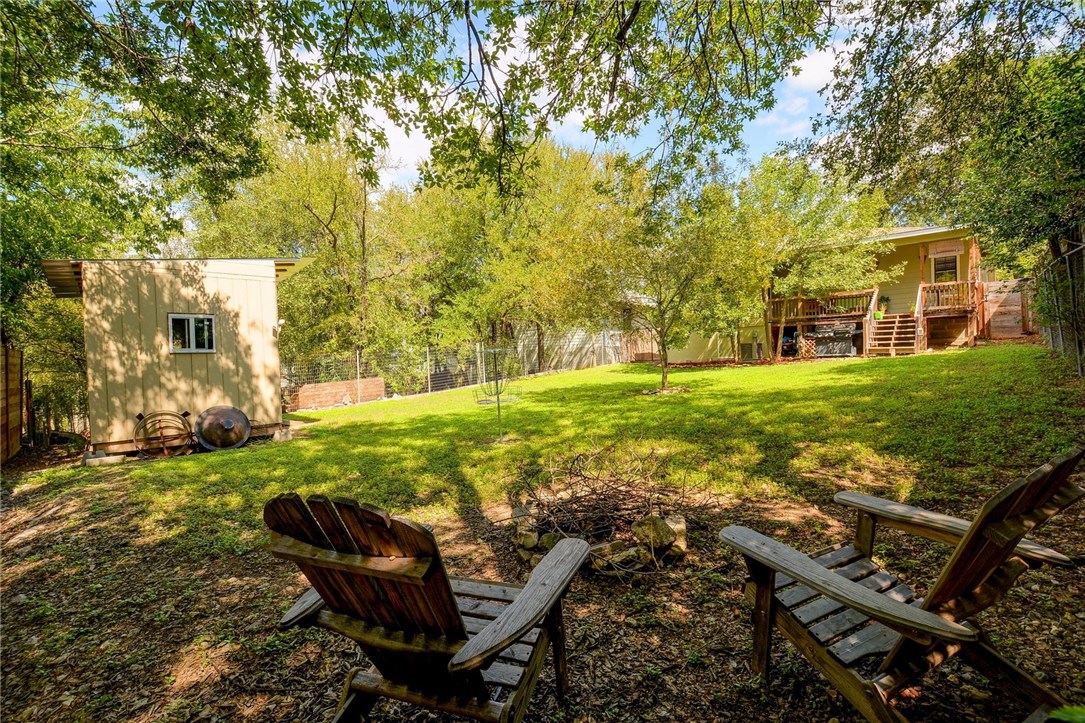 1228 Delano Street Austin, TX 78721 - Photo 1 of 1 Backyard is fully fenced and has lots of room to play. It even has a fire pit and they added a storage shed.