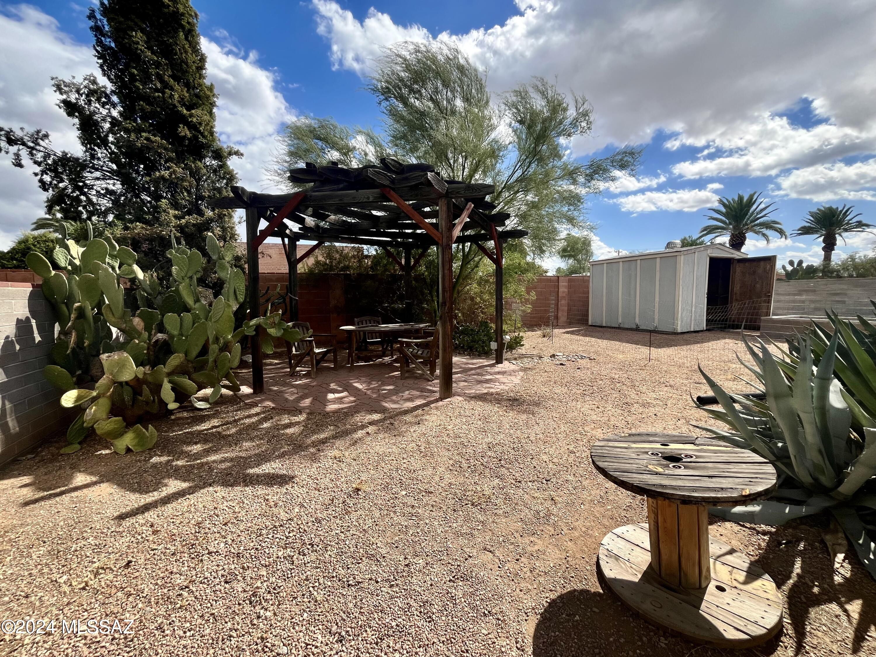 2118 North Rita Avenue Tucson, AZ 85716 - Photo 13 of 17 a view of a backyard with sitting area