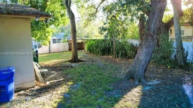 a view of a porch with furniture and yard