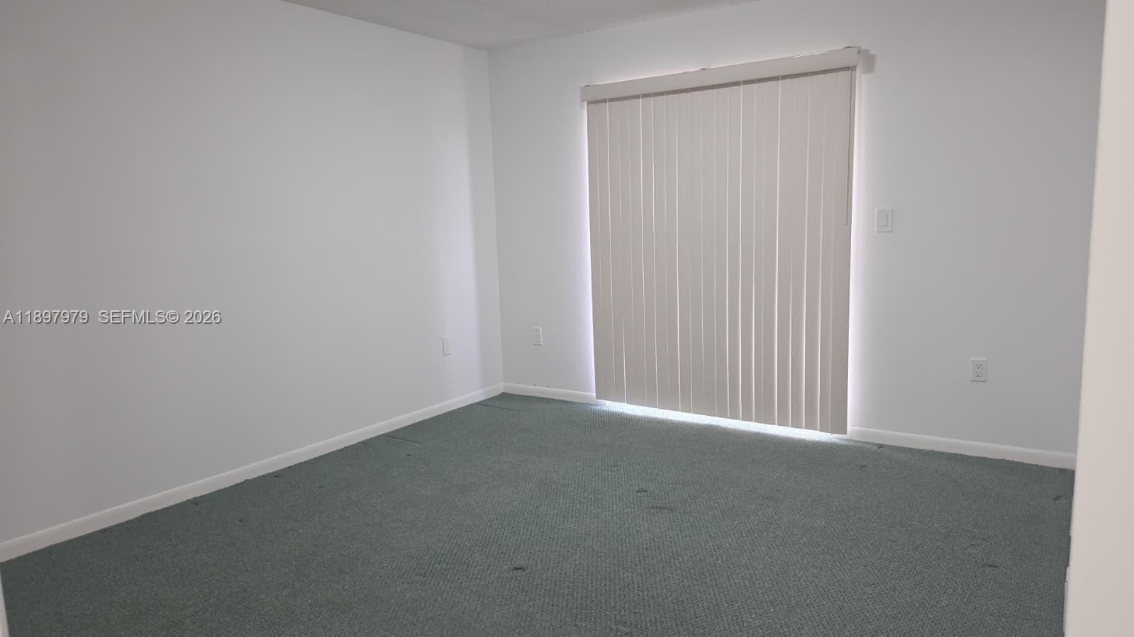 5249 Northwest 7th Street, Unit 418 Miami, FL 33126 - Photo 22 of 25 a view of an empty room