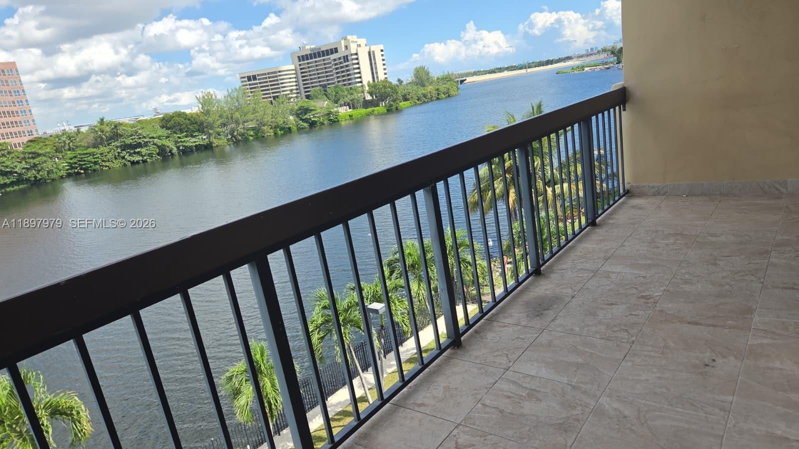 5249 Northwest 7th Street, Unit 418 Miami, FL 33126 - Photo 3 of 25 a view of city from a balcony