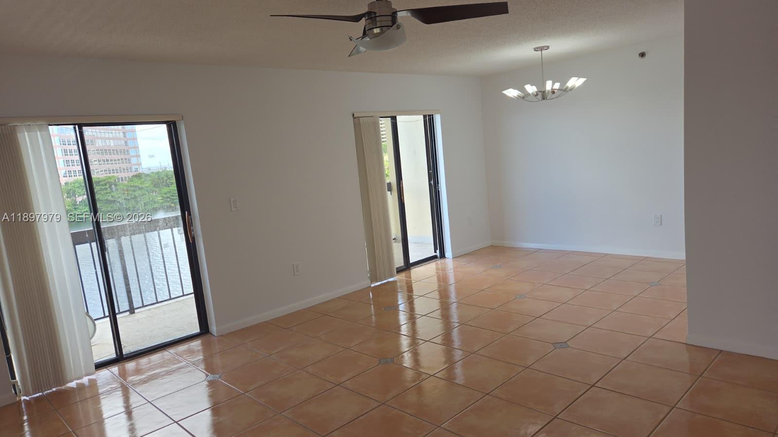 5249 Northwest 7th Street, Unit 418 Miami, FL 33126 - Photo 5 of 25 a view of an empty room and a window