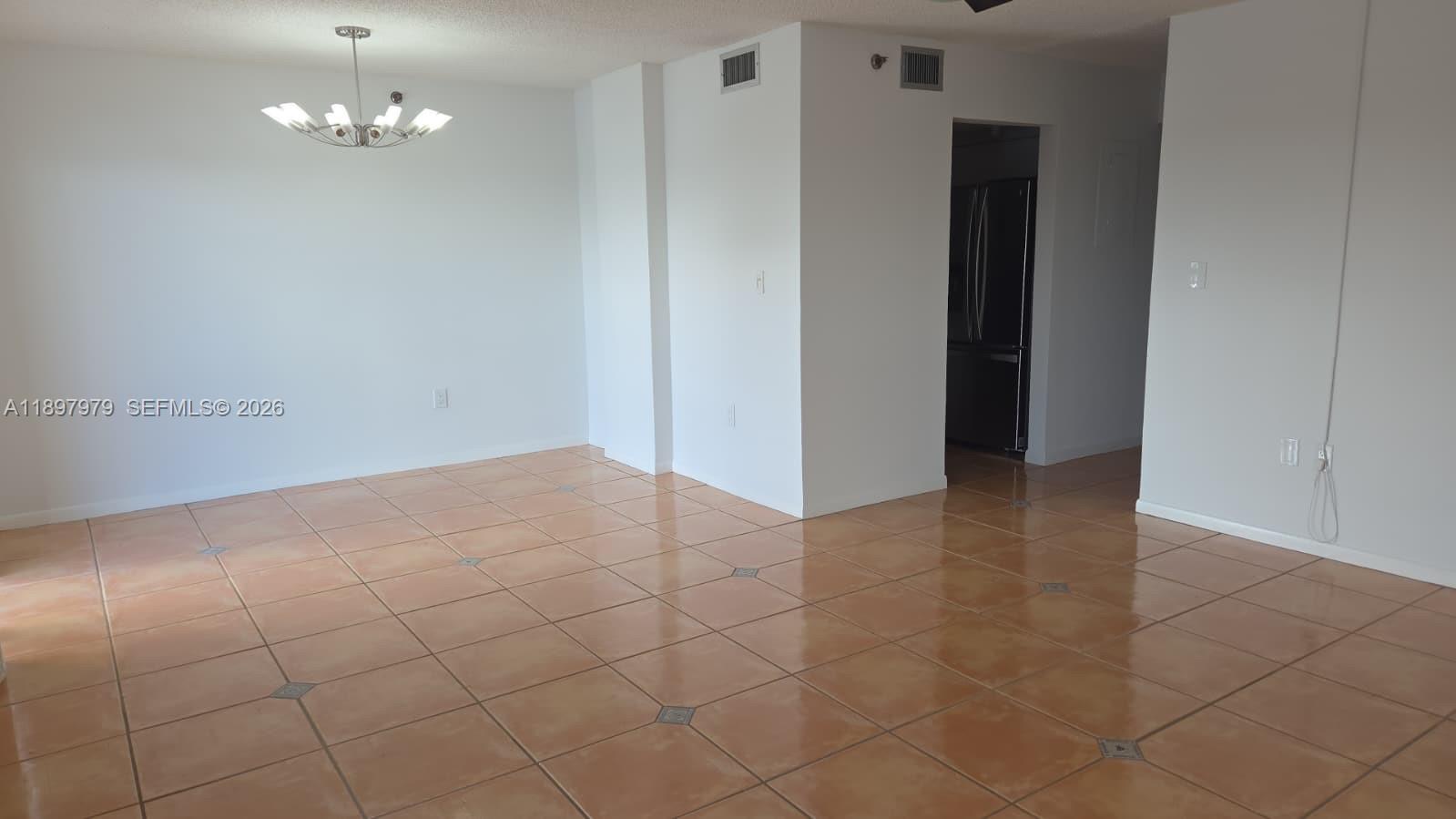 5249 Northwest 7th Street, Unit 418 Miami, FL 33126 - Photo 10 of 25 wooden floor in an empty room