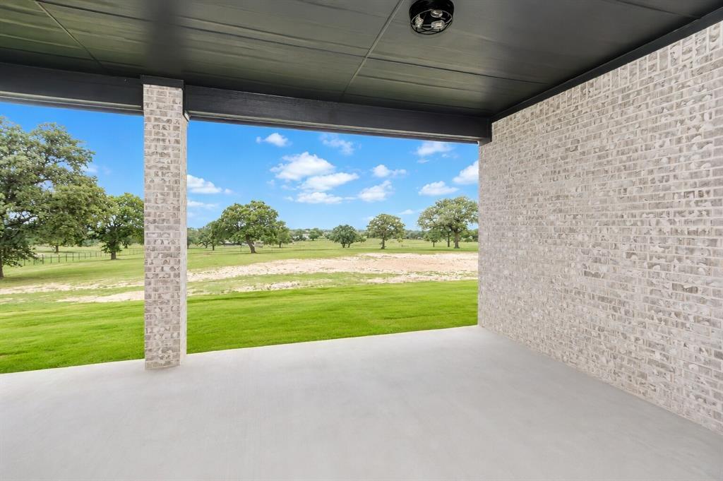 1057 Vh Ranch Poolville, TX 76487 - Photo 30 of 38 a view of a yard with an outdoor space