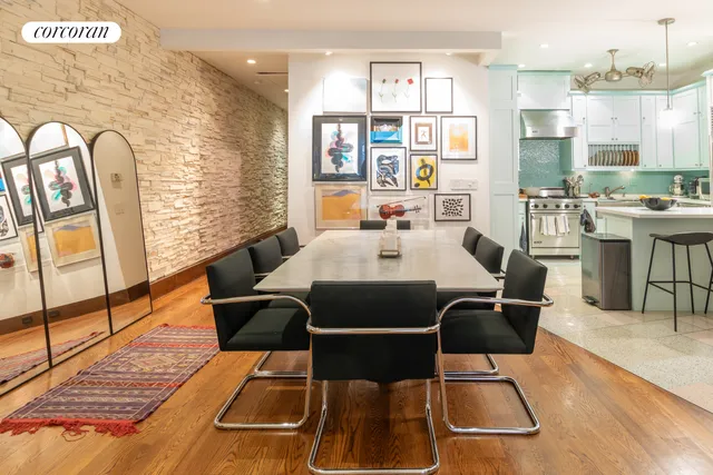 a kitchen with stainless steel appliances kitchen island granite countertop a sink and cabinets