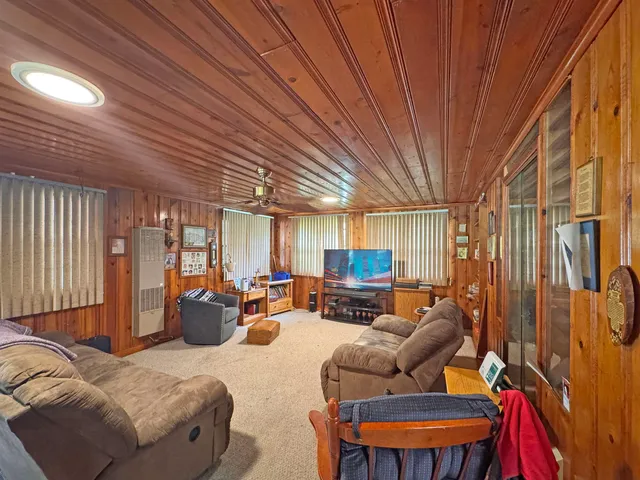 a kitchen with stainless steel appliances granite countertop a refrigerator a stove a sink dishwasher with a dining table and chairs