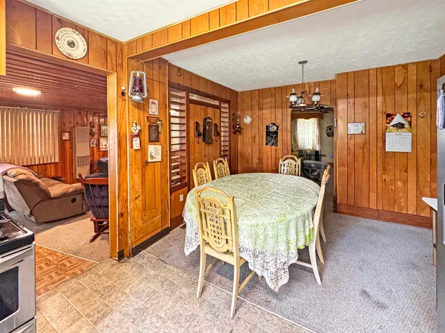 a bed room with a bed and a chandelier