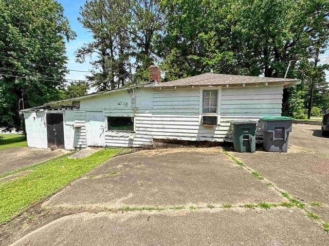 a view of a backyard with swimming pool