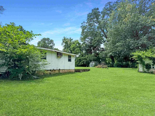 a bathroom with a shower and a glass door
