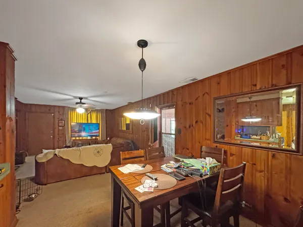 a view of a livingroom with furniture and entryway