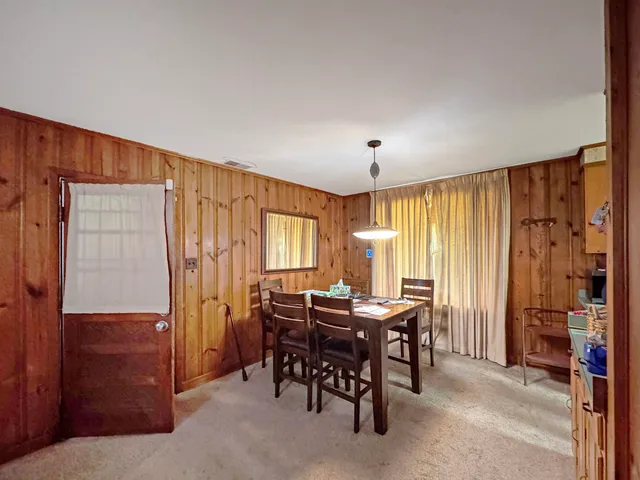 a view of a livingroom with furniture and window