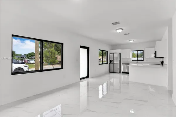 a view of an empty room with a window