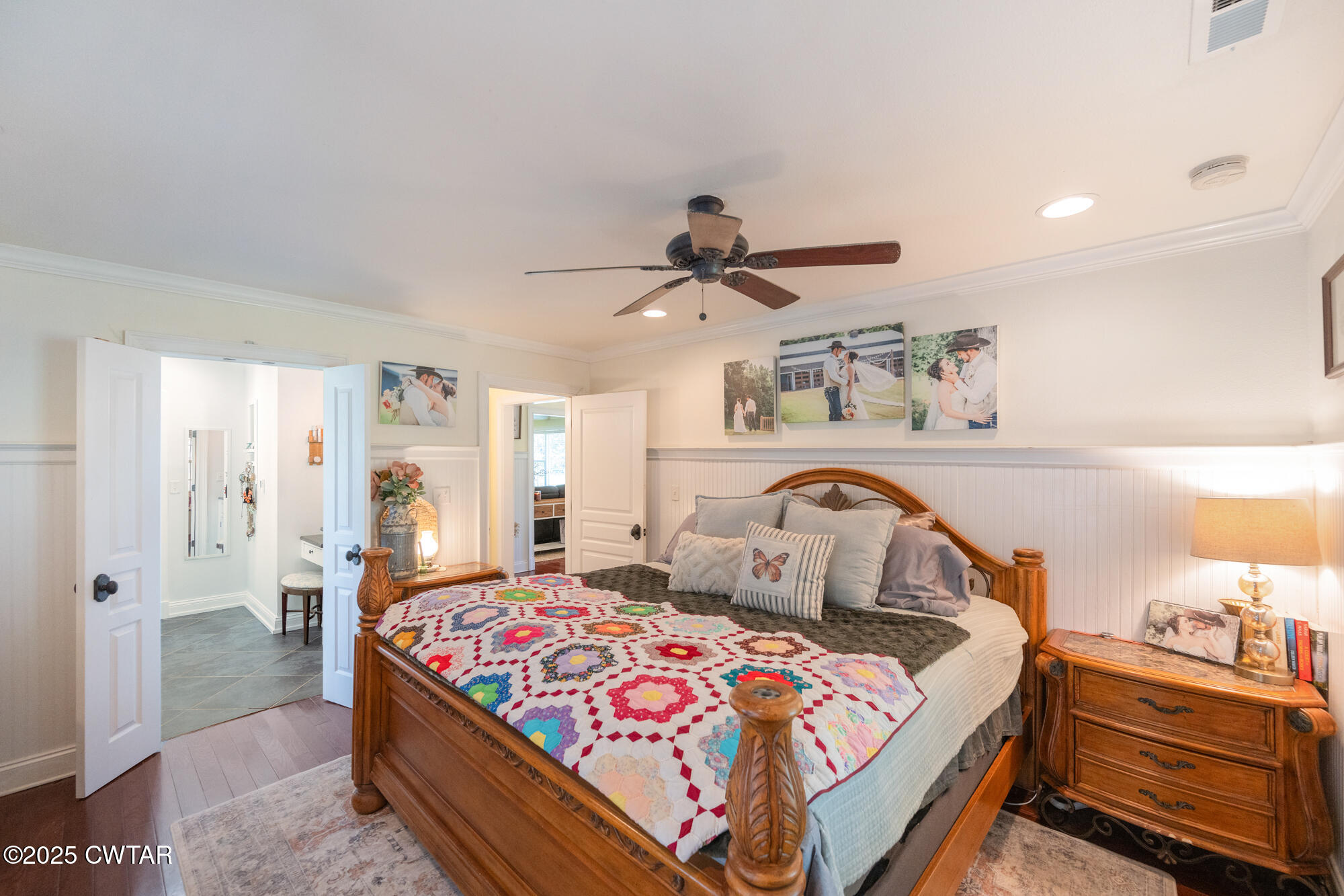 3685 Henderson Road Sardis, TN 38371 - Photo 21 of 46 a bedroom with a bed and a chandelier