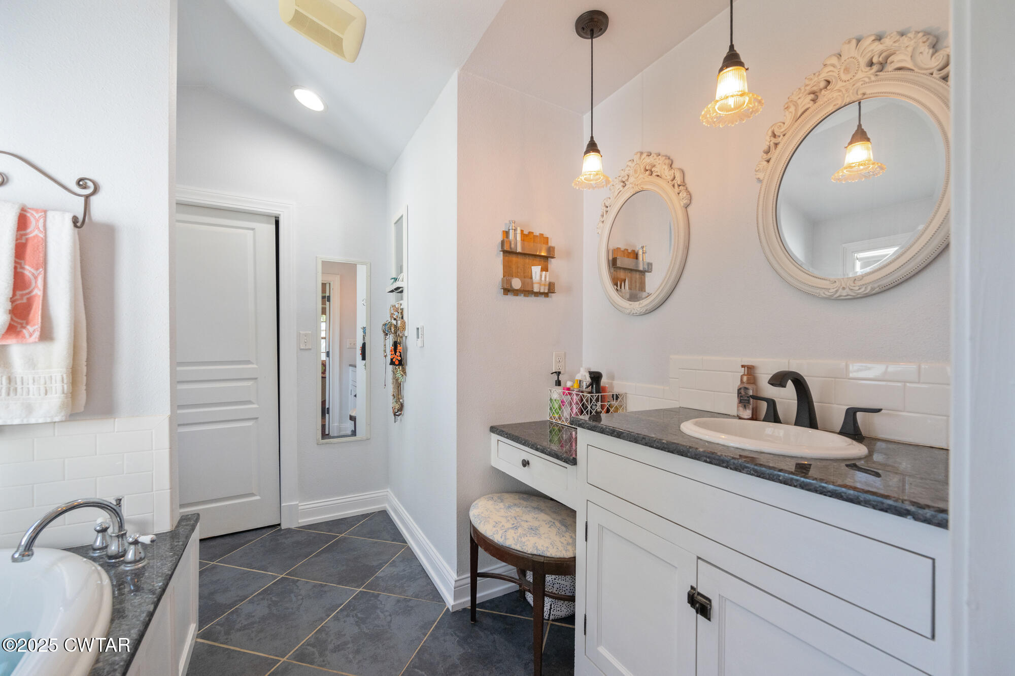 3685 Henderson Road Sardis, TN 38371 - Photo 22 of 46 a bathroom with a granite countertop sink a toilet and a mirror