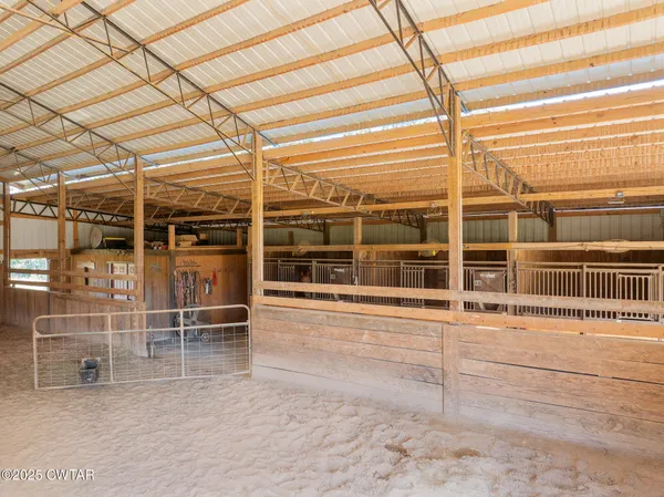 a view of a porch with a table and chairs