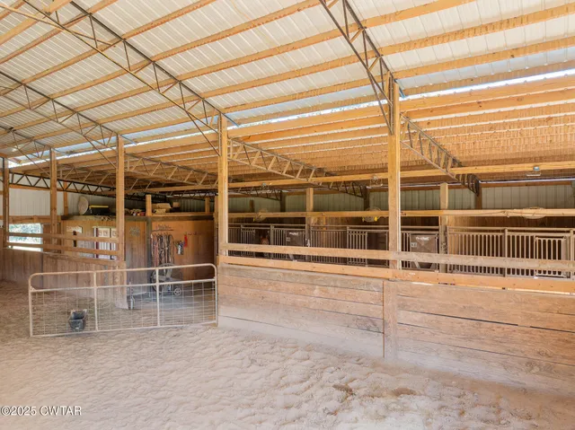 a view of a porch with a table and chairs