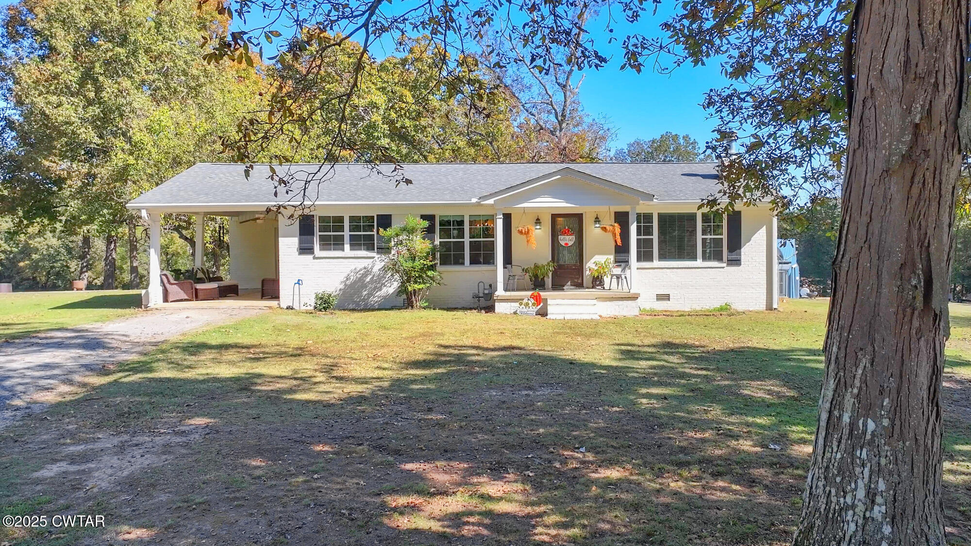 3685 Henderson Road Sardis, TN 38371 - Photo 3 of 46 a front view of a house with a yard balcony