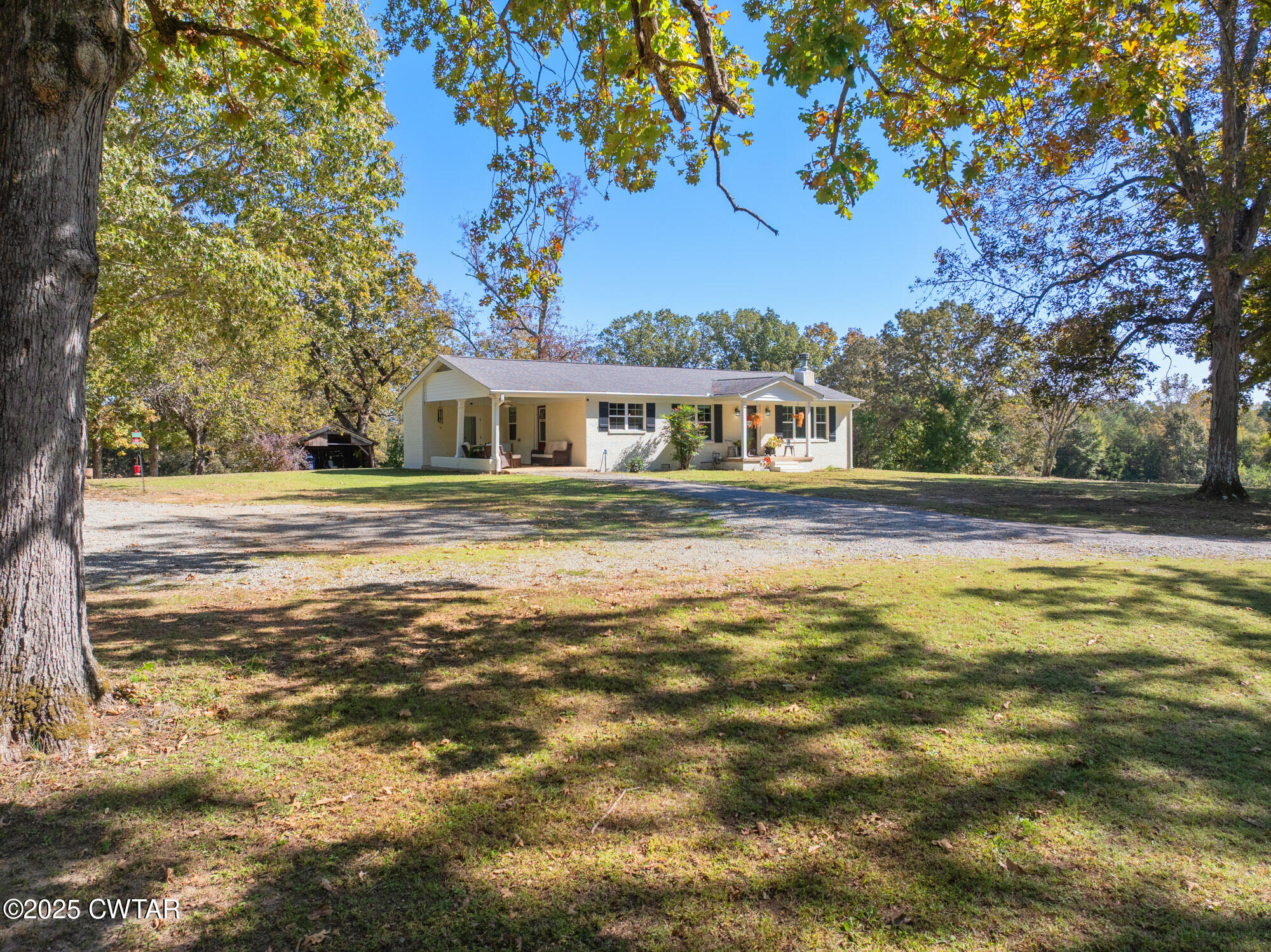 3685 Henderson Road Sardis, TN 38371 - Photo 36 of 46 a front view of a house with a garden