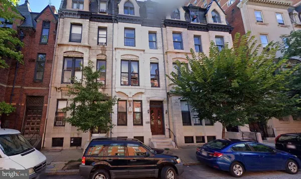a cars parked in front of a building