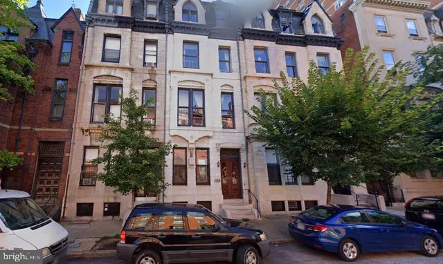 a cars parked in front of a building