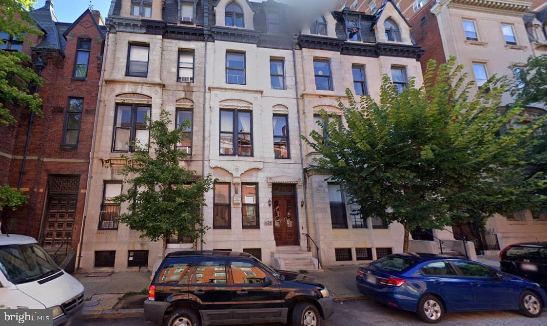 a cars parked in front of a building