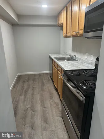 a kitchen with a stove and a sink