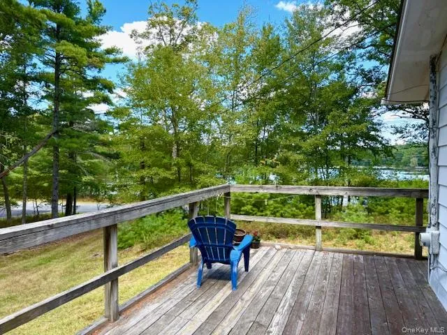 a view of a balcony with wooden floor and outdoor space