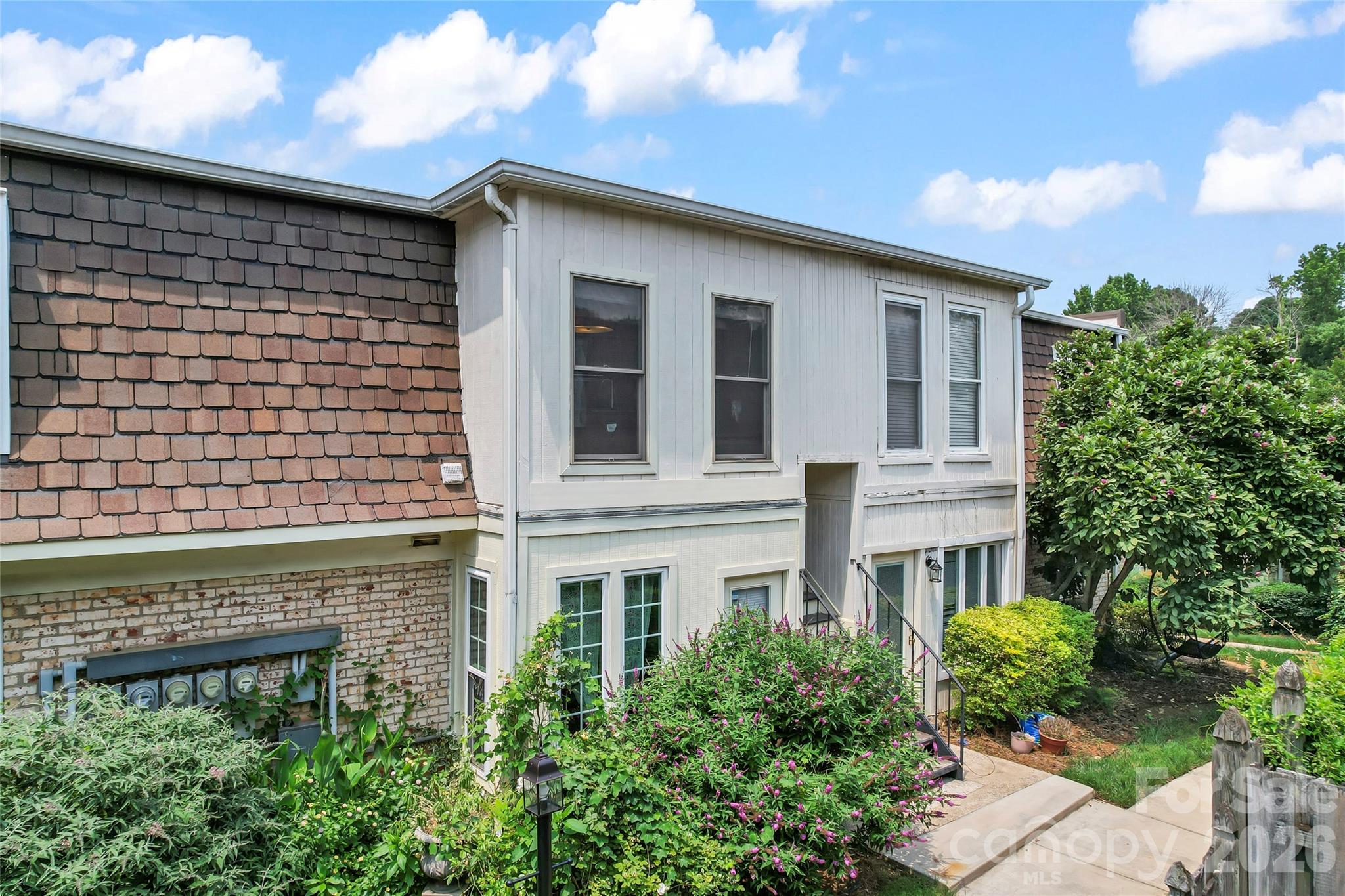 3520 Colony Road, Unit D Charlotte, NC 28211 - Photo 24 of 25 a front view of a building with a garden