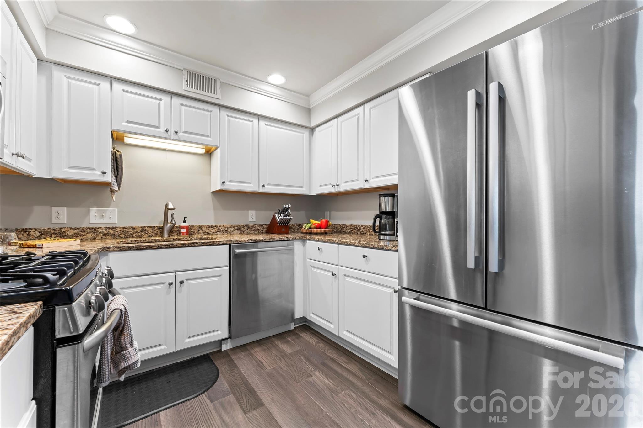 3520 Colony Road, Unit D Charlotte, NC 28211 - Photo 4 of 25 a kitchen with granite countertop a refrigerator stove and sink