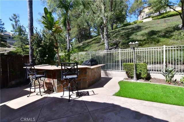 a view of a patio with a table chairs and a table